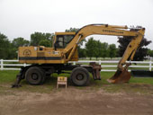 Колесный экскаватор Caterpillar 212